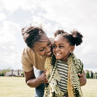 Mother and daughter smiling